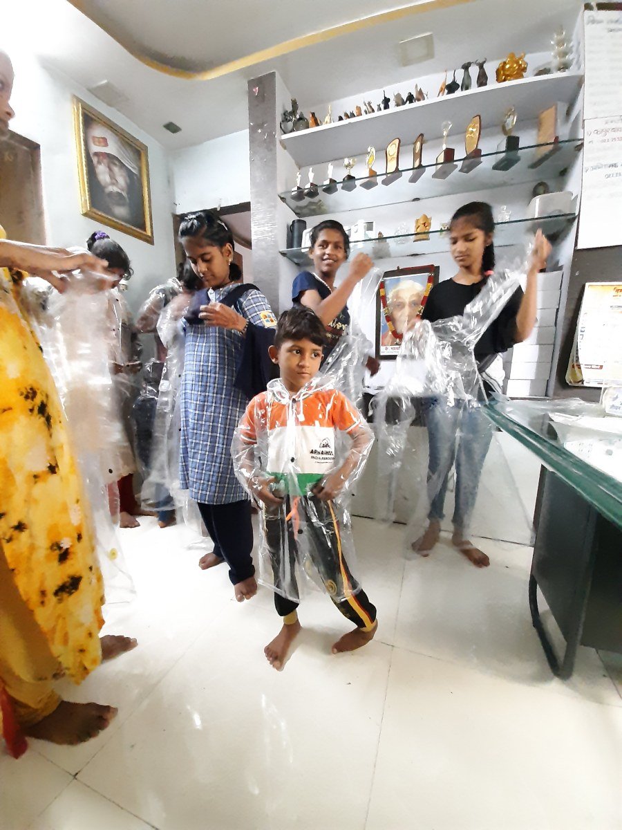 Distribution of Raincoats at Orphanages
