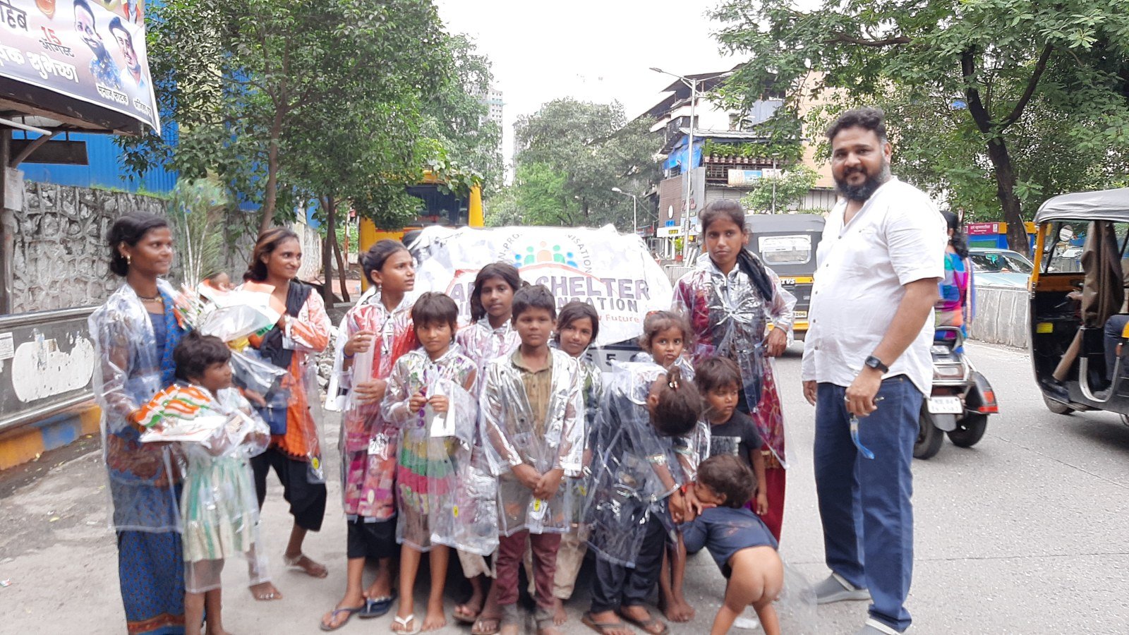 Distribution of Raincoats to Underprivileged  Kids vendors at Signals